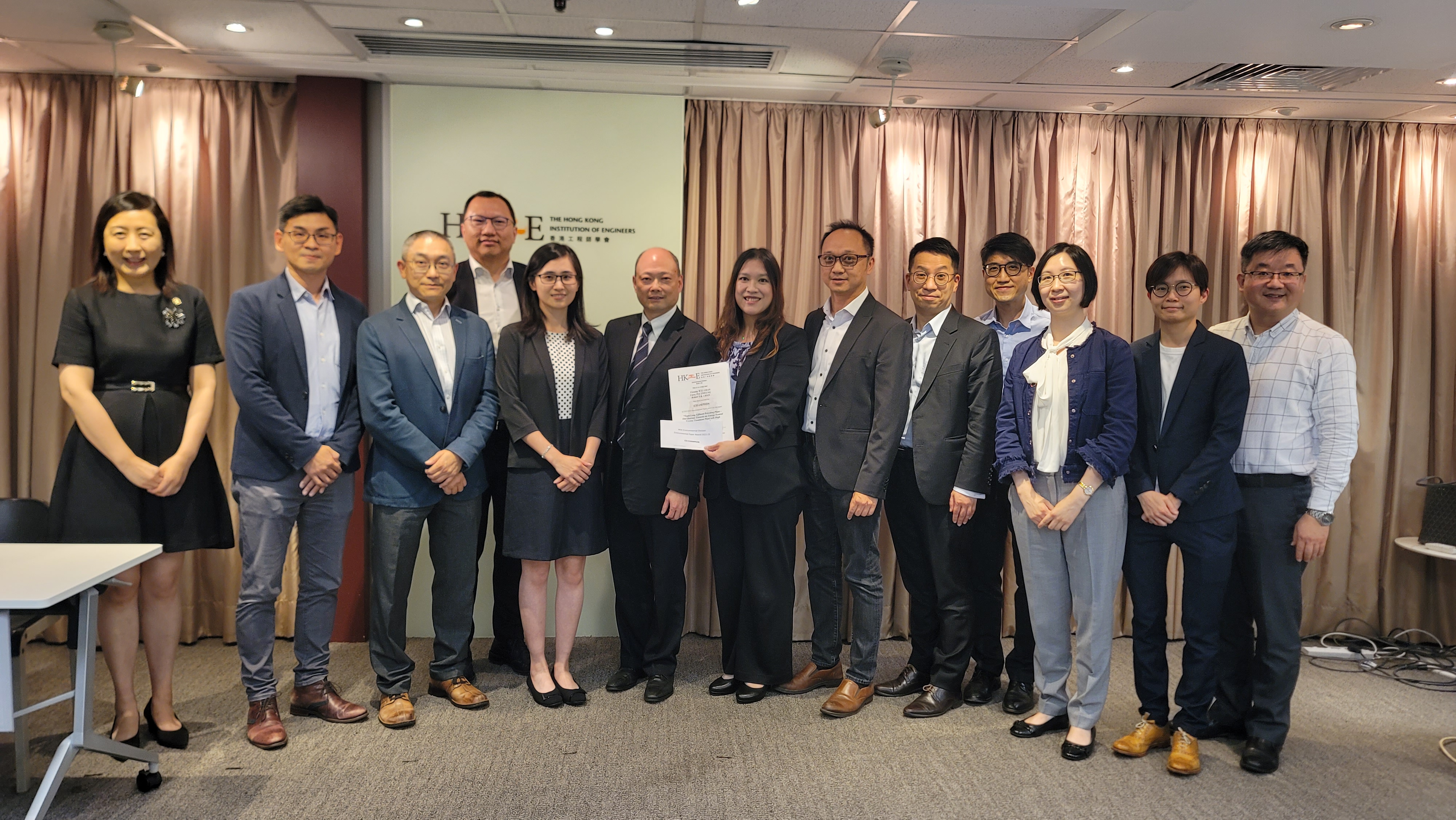 Assistant Director/Projects & Development, Mr. CHOI Wing-hing (eighth from right) and the YLEPP project team receiving the Certificate of Champion Prize.
