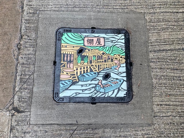 The coloured manhole cover installed in Tai O, with the theme of the stilt house
